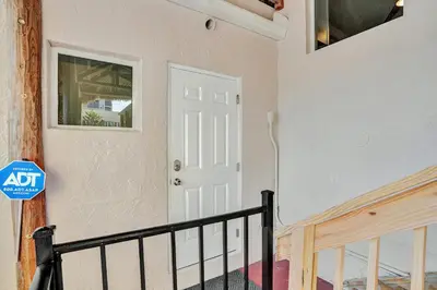 a white door in a room with a staircase at Beach Efficiency - Hollywood Beachfront and Broadwalk in Hollywood