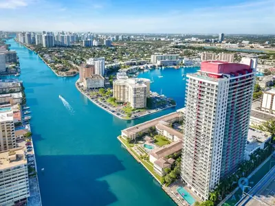an aerial view of a city with a river and buildings at Oasis with Inspiring Views, Amazing Pool and Gym in Hallandale Beach