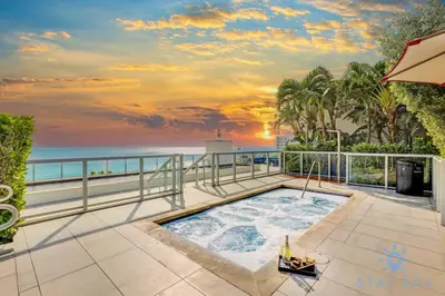a hot tub on a balcony overlooking the ocean at Amazing Pool - Hot Tub - Gym - Near Beach in Hollywood