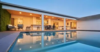 a swimming pool in front of a house at Villa Athena - The Glamhomes in Miami