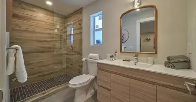 a bathroom with a toilet and a sink and a shower at Villa Athena - The Glamhomes in Miami