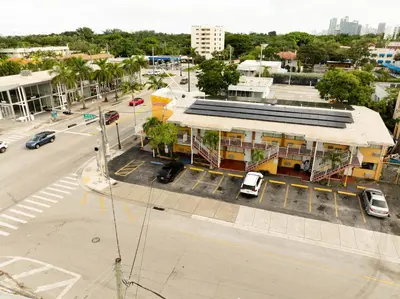an overhead view of a building with a parking lot at Sinbad Motel in Miami