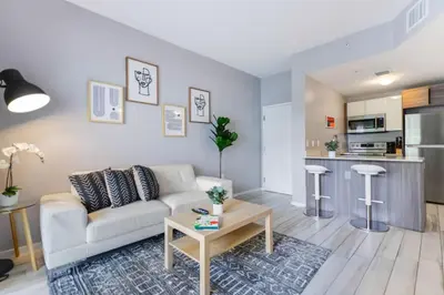 a living room with a couch and a table at Wynwood Amazing Condo Sleeps 5 Close to Beach in Miami