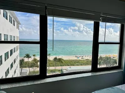 a view of the ocean from a hotel room window at Directly on the Beach with Pool & Ocean View in Miami Beach