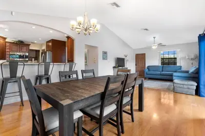 a dining room and living room with a table and chairs at DOWNTOWN LAS OLAS WATERFRONT HOME UPDATED UNIT in Fort Lauderdale
