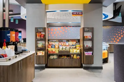 a food section of a store with food on display at Tru By Hilton Miramar in Miramar