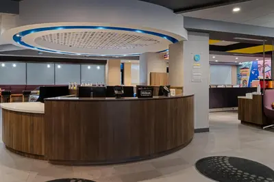 a lobby with a reception counter in a hospital at Tru By Hilton Miramar in Miramar