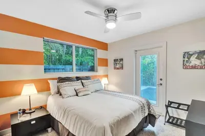 a bedroom with a bed and a window at 3bed 2bath with pool, 5 min. walk to food and fun in Fort Lauderdale