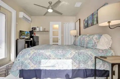 a bedroom with a king sized bed in a room at Private studio, 5 min. walk to Wilton Drive in Fort Lauderdale