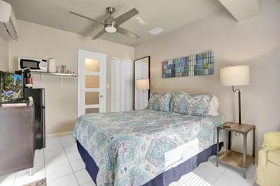 a bedroom with a bed and a ceiling fan at Private studio, 5 min. walk to Wilton Drive in Fort Lauderdale