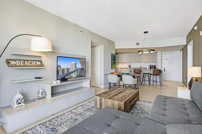 a living room with a couch and a tv at Luxury 2BR 2BA Water Front in Hyde Beach Resort in Hollywood