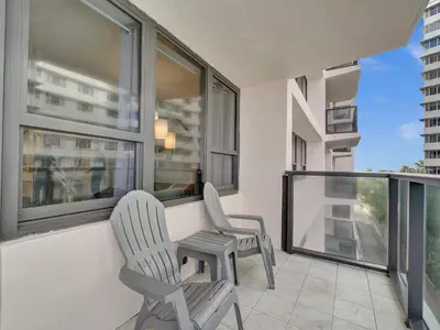 two chairs sitting on the balcony of a apartment at Ocean View Beach Retreat Beach Service 606 in Miami Beach
