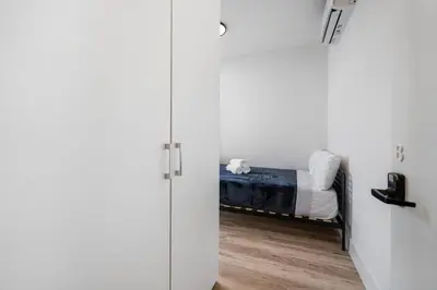 a door leading to a bedroom with a bed at Pastel Apartments in Miami