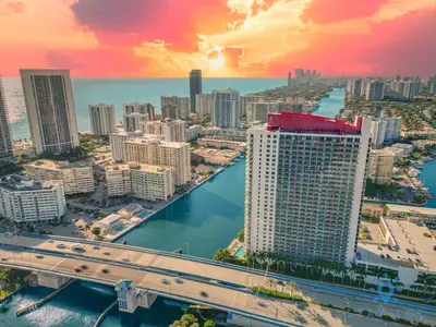 an aerial view of a city with a bridge at Resort Near Beach with Amazing Pool and Gym in Hallandale Beach