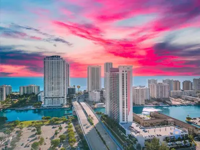 a view of a city skyline with a red sky at Resort Near Beach with Amazing Pool and Gym in Hallandale Beach