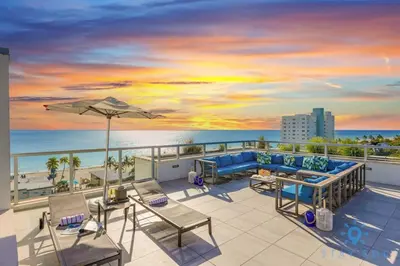 a balcony with a view of the beach and the ocean at Front Bay View, Enjoy Sunsets, Amazing Pool in Hollywood