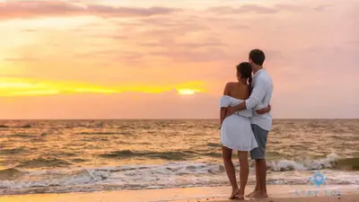 a couple standing on the beach watching the sunset at Worth Traveling Hot tub & Unique Rooftop pool in Hollywood