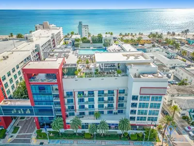 an aerial view of a building next to the ocean at The Most Liked Homes Hot tub & Unique Rooftop in Hollywood
