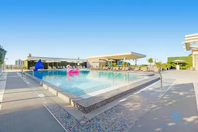 a swimming pool at a resort with people in it at Rooftop Pool & Hot Tub Hollywood Beach Gym in Hollywood