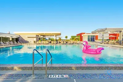 a swimming pool with a pink flamingo in the water at Rooftop Pool & Hot Tub Hollywood Beach Gym in Hollywood