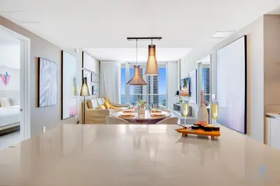 a living room with a large table and a living room at Awesome Ocean View and Amenities, Pools - 2 BR in Hollywood