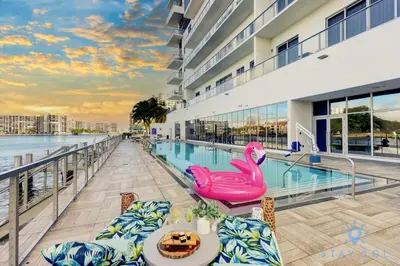 a swimming pool with a pink swan on a balcony at Awesome Ocean View and Amenities, Pools - 2 BR in Hollywood
