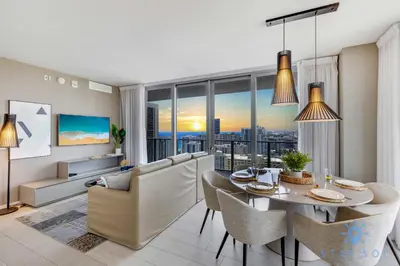a living room with a table and chairs and a large window at Luxury 3 BR Stunning View & High Floor Hot Tub in Hollywood