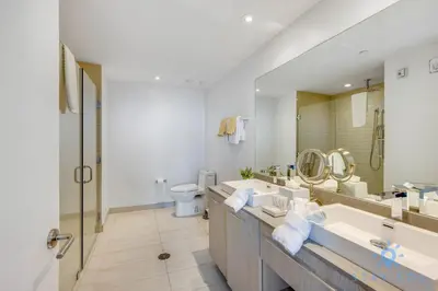 a bathroom with two sinks and a toilet at Luxury 3 BR Stunning View & High Floor Hot Tub in Hollywood