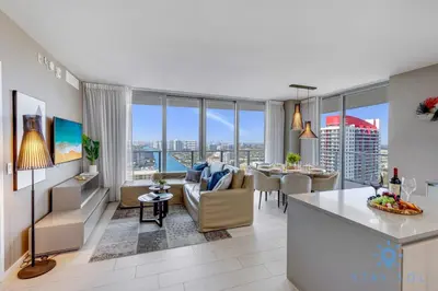 a kitchen and living room with a view of the city at Luxury 3 BR Stunning View & High Floor Hot Tub in Hollywood