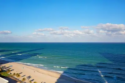 an aerial view of a beach and the ocean at Beachfront Resort Pool Ocean View Balcony Gym in Aventura