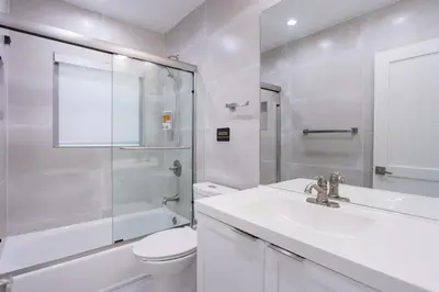 a bathroom with a sink and a toilet and a shower at WALK to Hollywood Beach Spectacular 5BR and 5BA Villa in Hollywood