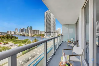 a balcony with a view of the city at Modern 2 BR - Beachwalk Resort - Pool - Gym in Hallandale Beach