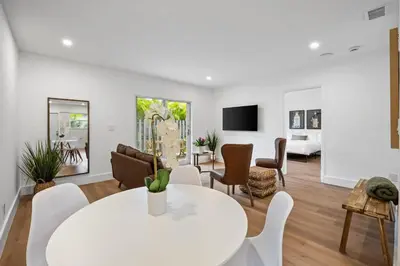 a living room with a white table and chairs at Sailors Rest @ Sailboat Bend in Fort Lauderdale