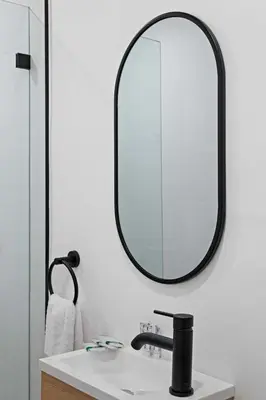 a bathroom with a sink and a mirror at Sailors Rest @ Sailboat Bend in Fort Lauderdale