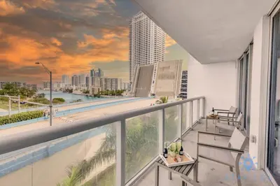 a balcony with a view of the city at Modern Condo - Amazing Pool - Gym - Balcony in Hallandale Beach