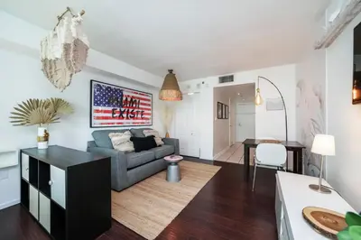 a living room with a couch and a table at FREE Dinner at Crazy About You Restaurant in Miami