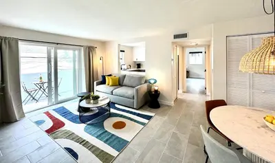a living room with a couch and a table at Modern / Central / Free Pkg in Miami Beach