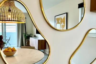 a room with a table and a mirror at Modern / Central / Free Pkg in Miami Beach