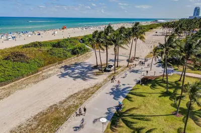 an aerial view of a beach with palm trees at Cozy South Beach 1BR Apt Near Beach & Ocean Drive in Miami Beach