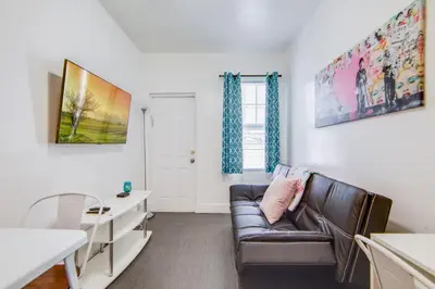 a living room with a couch and a table at Comfy 1 B/R, Near Ocean Dr & Beach - South Beach in Miami Beach