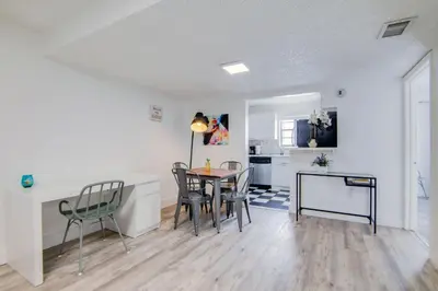 a kitchen and dining room with a table and chairs at 2B/2B, Free Parking, South Beach, 1 Block 2 Beach in Miami Beach