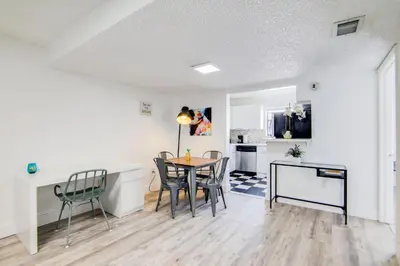 a kitchen and dining room with a table and chairs at 2B/2B, Free Parking, South Beach, 1 Block 2 Beach in Miami Beach