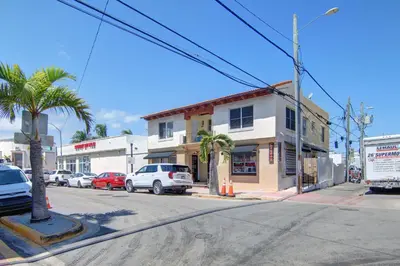 a street corner with cars parked on a street at 2 B/R- Heart of South Beach, Near Ocean Dr & Beach in Miami Beach