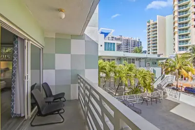 a balcony with chairs and a view of the ocean at Balcony Beach View w/2 Queen beds, Ocean Dr Beach in Miami Beach