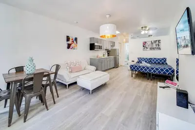 a living room and dining room with a table and a couch at Beachside 1 b/r, w/2 Queen Beds, Ocean Drive SOBE in Miami Beach