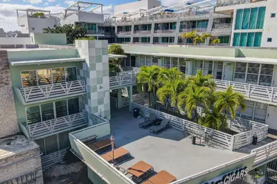 an overhead view of a building with palm trees at Beachside 1 b/r, w/2 Queen Beds, Ocean Drive SOBE in Miami Beach