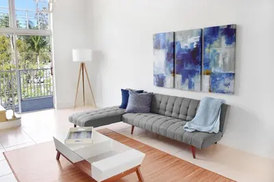 a living room with a couch and a table at Suites at Coral Resorts in Miami