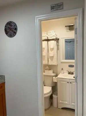 a bathroom with a toilet and a sink at Casita Cafe in Miami