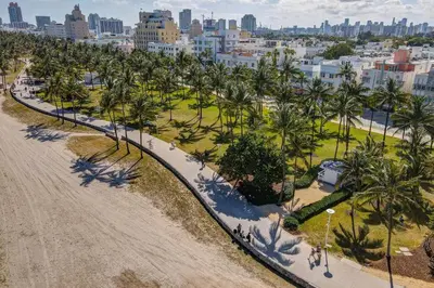 an aerial view of a park with palm trees and a city at Ocean Drive Beach Fun, w/2 Queen Beds South Beach in Miami Beach