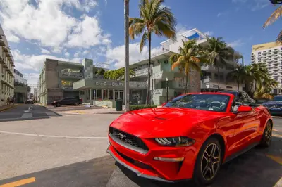 a red car is parked in a parking lot at Ocean Drive Best Deal, w/2 Queen Beds, Near Beach in Miami Beach